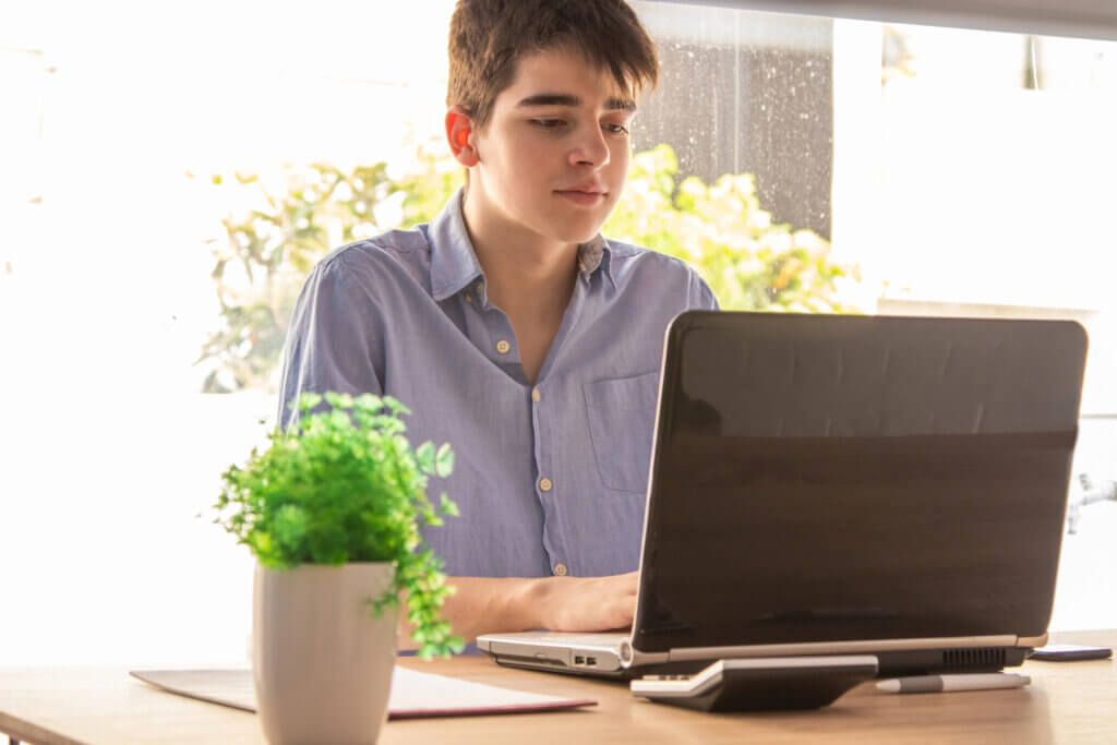 High school student at laptop